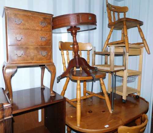 A group of furniture, to include a walnut three drawer chest, on cabriole legs, 75cm high, a mahogany occasional table, the circular top inset with a green tooled leather panel, 60cm high, a kitchen three tier trolley, stools, etc. (a quantity)