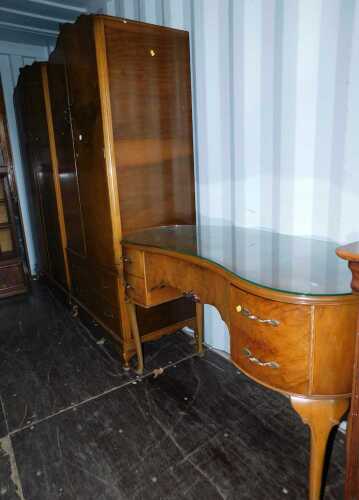 Two 20thC burr walnut wardrobes, comprising a double wardrobe, and a further double wardrobe with two drawers to the base, together with a kidney shaped dressing table.