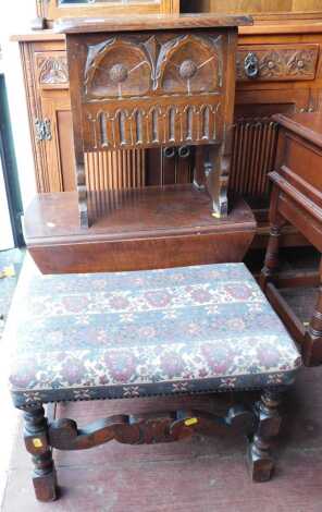 A 20thC oak sewing box, with a carved front, on shaped end supports, 45cm high, together with an oak drop leaf gateleg table, 48cm high, and an oak stool with tapestry upholstery. (3) The upholstery in this lot does not comply with the 1988 (Fire & Fire F