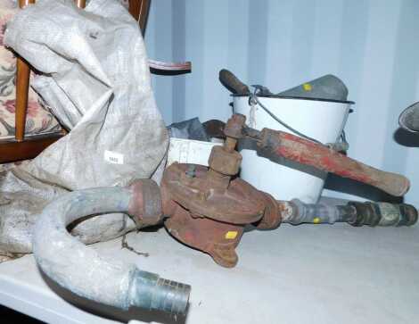 A white enamel bucket, containing various tools, including a No. 3 semi rotary pump, etc.