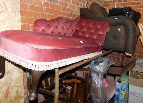 A brown fabric and leatherette upholstered armchair, together with a button-back chaise, and a faux leather pouffe. (3) 
The upholstery in this lot does not comply with the 1988 (Fire & Fire Furnishing) Regulations, unless sold to a known exporter or upho