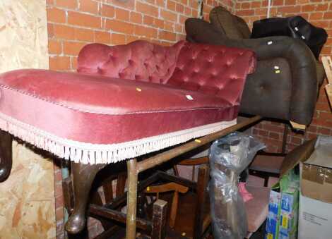 A brown fabric and leatherette upholstered armchair, together with a button-back chaise, and a faux leather pouffe. (3) 
The upholstery in this lot does not comply with the 1988 (Fire & Fire Furnishing) Regulations, unless sold to a known exporter or upho