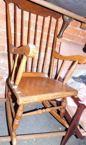 An oak spindle back rocking chair.