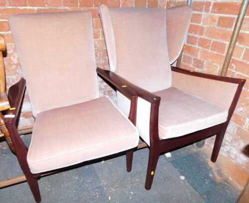 Two Parker Knoll armchairs. 
The upholstery in this lot does not comply with the 1988 (Fire & Fire Furnishing) Regulations, unless sold to a known exporter or upholsterer it will be cut from the frame before leaving the premises.