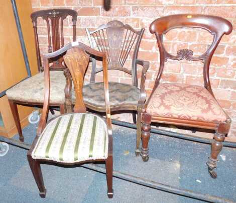 A Victorian balloon back dining chair, and three Edwardian inlaid bedroom chairs. (4)