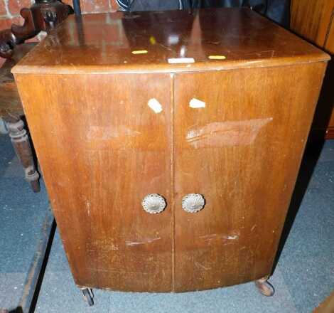 A walnut two door side cabinet, on castors, 64cm high.