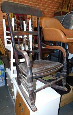 A 19thC countrymade oak rocking chair, with turned back, solid seat, turned legs with stretchers.