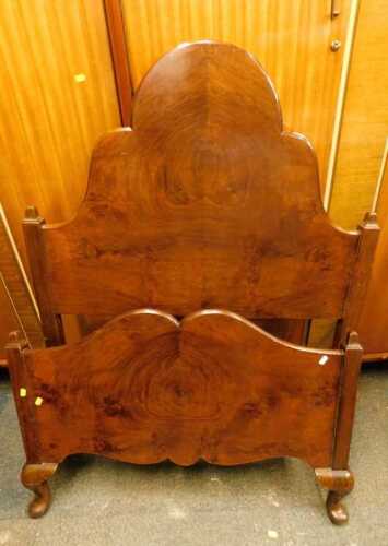 A 1920s walnut single bed head and footboard.