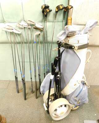 A golf bag, containing a set of Craigton golf clubs, and accessories.