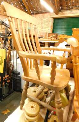 A beech lath back grandfather chair, with a solid seat on turned legs, with double H stretcher. (AF)