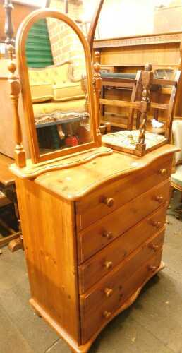 A pine chest of five drawers, 95cm high, 83cm wide, 47cm deep, together with a pine swing frame mirror, and an oak ladder back chair with a rush seat. (3)