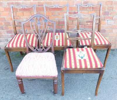 A set of four early 20thC oak dining chairs, each with a tapestry drop in seat, together with a 19thC shield back dining chair, on turned and fluted legs. The upholstery in this lot does not comply with the 1988 (Fire & Fire Furnishing) Regulations, unles