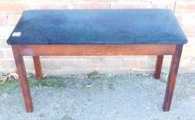 A mahogany framed duet piano stool, with black fabric overstuffed seat, 84cm wide. The upholstery in this lot does not comply with the 1988 (Fire & Fire Furnishing) Regulations, unless sold to a known exporter or upholsterer it will be cut from the frame