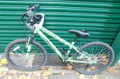 A Trail Blazer off road bicycle, in bright green trim, with a V Verve helmet.