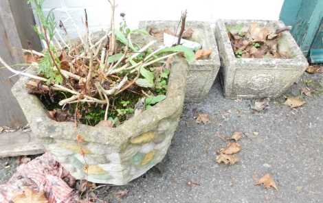 A pair of composition stone planters, of square tapering form decorated with flowers, 24cm high, 26cm wide, 26cm deep, and another. (3)