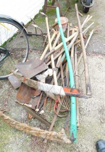 Various garden tools, to include scythe, rakes, garden forks, terracotta garden pots, etc. (a quantity)