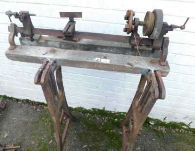 A lathe, on wooden cast iron stand. (AF)