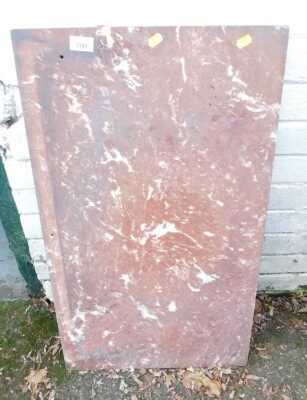 A piece of red marble, of rectangular form, drill holes present, 76cm x 44cm.