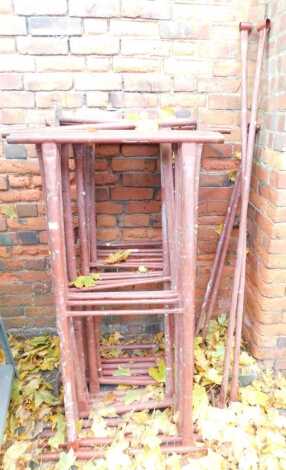 A scaffold tower, lacking wooden boards.