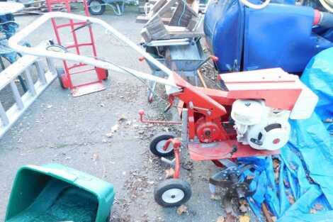 A Rotary tiller, with Briggs & Stratton 7hp motor.