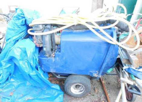 An industrial petrol garden vacuum, with tow bar attachment and piping, 125cm wide.