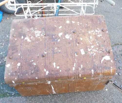 A domed metal trunk, together with a wheelbarrow, metal jardiniere stand, garden tools, etc. (a quantity)