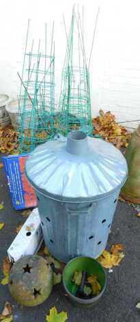 A garden incinerator, together with various conical garden support rings, terracotta garden ball of pierced star decoration, further garden related items, etc. (a quantity)