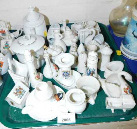 A group of crested china, comprising swan trinkets, teapot, house, vases, etc. (1 tray)