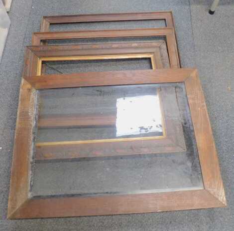 Four various oak picture frames, one with glass.