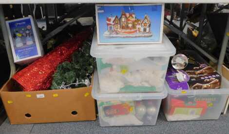 A large group of assorted Christmas decorations, to include Premier light up snowman, cottages, baubles, outdoor lights, sparkle lights, etc. (all under one table)