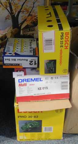 A Dremel mortar unit, a twelve piece Router bit set, Bosch PHO30080-82 sander and a Bosch PSS23E sander, boxed. (4)