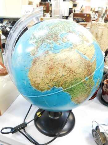 An electric spinning table top globe.