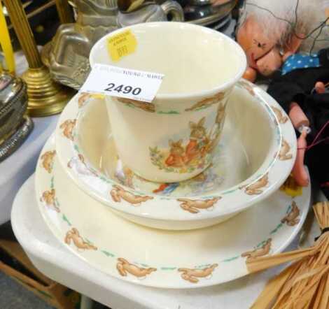 A Bunnikins cup, child's bowl and plate.