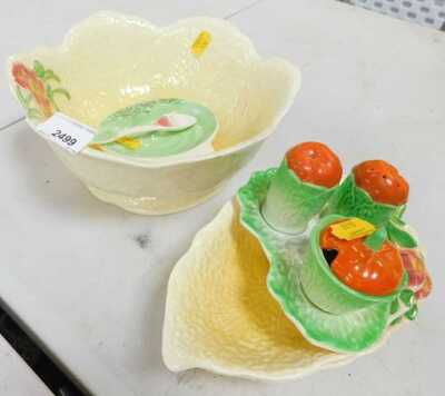 A Carltonware yellow leaf moulded salad bowl, two servers, a three-piece cruet and a pin dish with spoon.