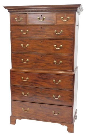 A 19thC mahogany tallboy or chest on chest, with dentil moulded cornice over three short drawers and three long to the upper part, the base having three graduated drawers with brass swan neck handles to bracket feet, 187cm high, 104cm wide.