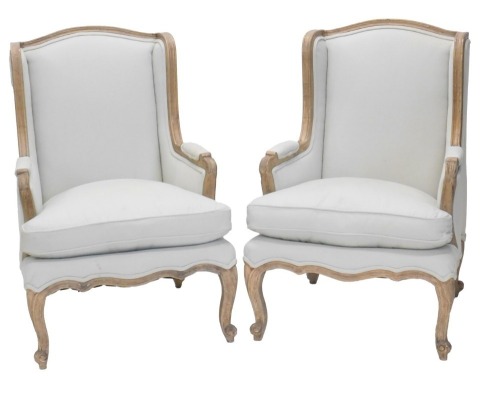 A pair of 19thC Continental wingback armchairs, with modern upholstery.