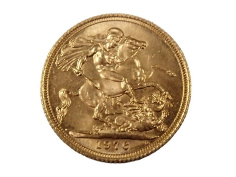 An Elizabeth II full gold sovereign dated 1976.