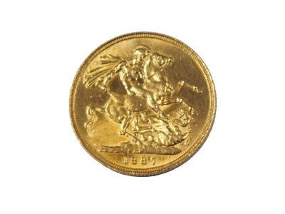 A Victorian full gold sovereign dated 1887.