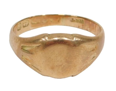 A 15ct gold signet ring, the oval panel of plain design, ring size M½, with rubbed marks possibly Birmingham, 4.5g all in.