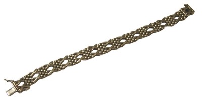 A 9ct gold bracelet, of two cross and dot design, 19cm long, 17.4g, boxed.