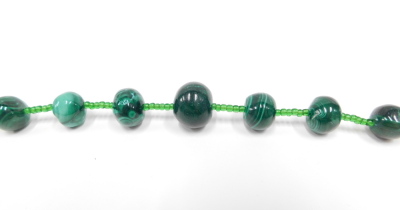 A graduated malachite beaded necklace, the smallest bead 2mm wide, the largest 13mm wide, on string strand, with dark green beads, 70cm long overall, 125.6g all in. - 2