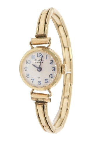 A Bentina Star 9ct gold cased lady's wristwatch, on a rolled gold expanding strap, 12.3g all in.