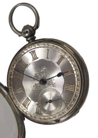 A Victorian silver pocket watch, the silvered and rose gold floral dial, with Roman numerals, blue hands and seconds dial, the outer case of engraved design with shield, bearing the initials CJ, key wind, movement stamped Isaac Goldman of Sunderland and n