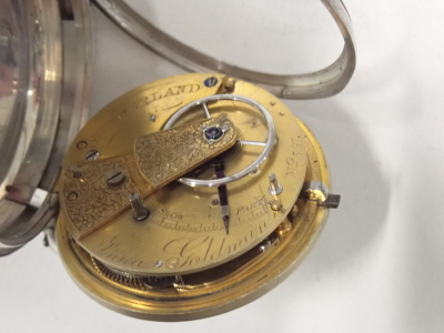 A Victorian silver pocket watch, the silvered and rose gold floral dial, with Roman numerals, blue hands and seconds dial, the outer case of engraved design with shield, bearing the initials CJ, key wind, movement stamped Isaac Goldman of Sunderland and n - 2