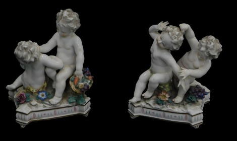 A pair of 19thC Continental porcelain figure groups of cherubs, 18cm high.