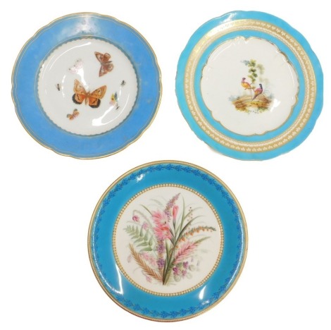 A 19thC French porcelain dessert plate, decorated with birds within a turquoise band, and two other English plates with turquoise bands. (3)