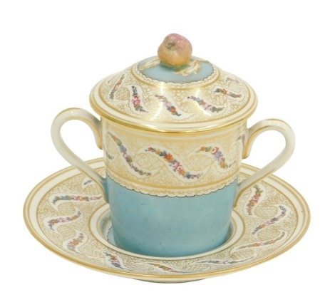 A Sevres Chateau du Tuileries marked two handled chocolate cup, cover and stand, each decorated with floral garland, within a gilt decorated band above a band of mottled powder blue, pseudo printed marks to underside.