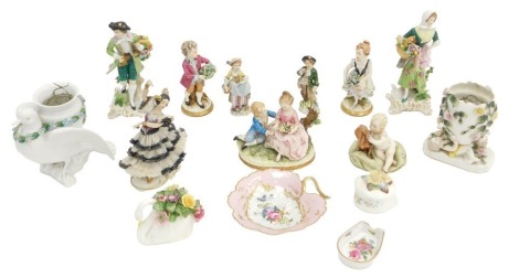 A pair of German porcelain figurines, each modelled in the form of a lady and gentleman holding a basket of flowers, gold anchor mark to underside, 19cm high, and various other Continental figures.