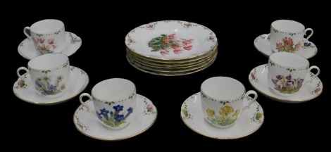 A Continental porcelain part tea service, printed with botanical specimens, to include six cups and saucers, and side plates.