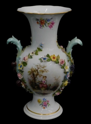 A late Meissen porcelain two handled vase, printed with a panel depicting a lady with child, dog and sheep, within flower encrusted borders, blue cross swords mark to underside, 27cm high.